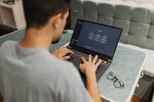 A man using ChatGPT on a laptop